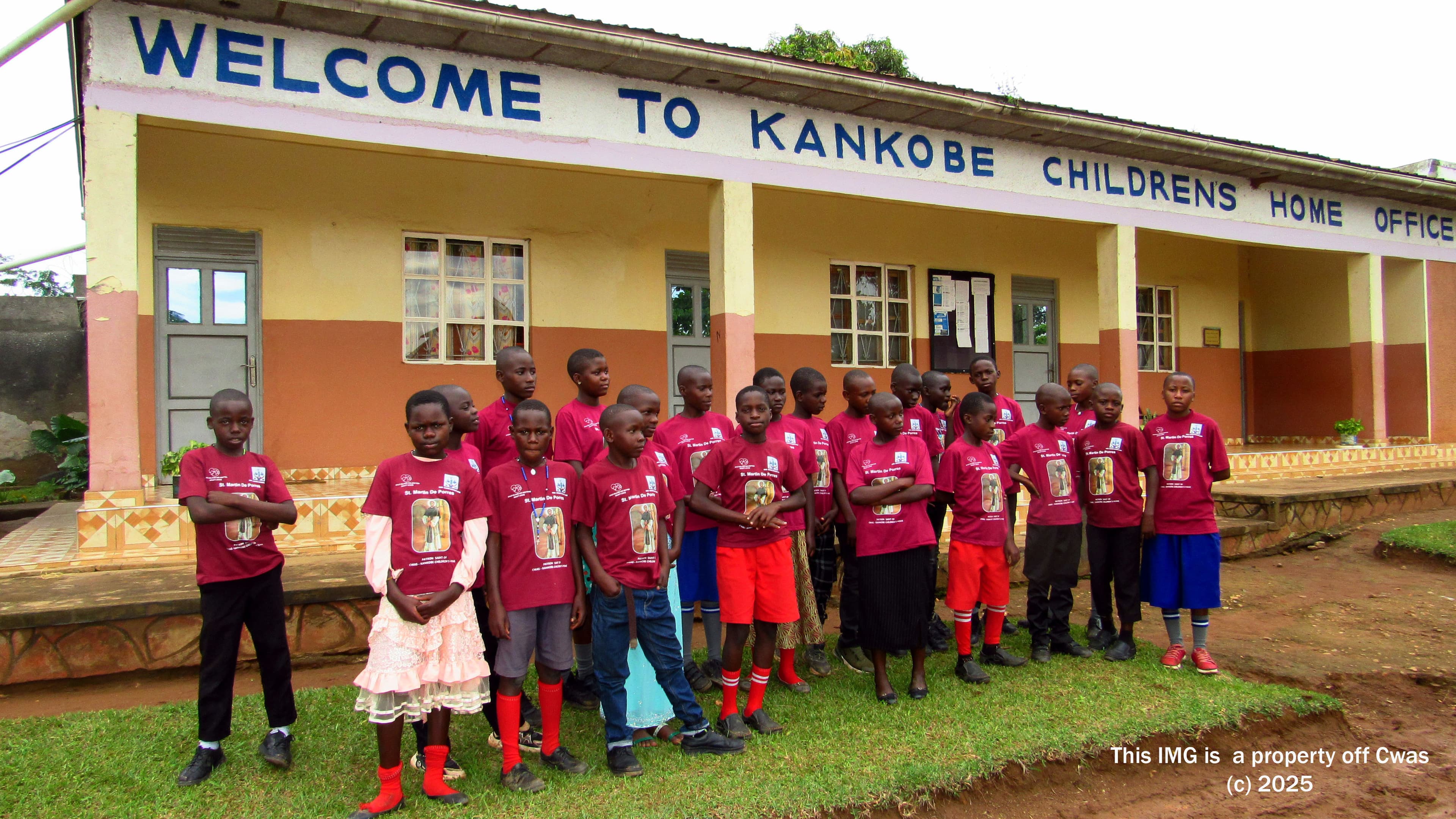 Children standing outside the office of Kankobe Children’s Home, part of the Child Welfare and Adoption Society (CWAS)