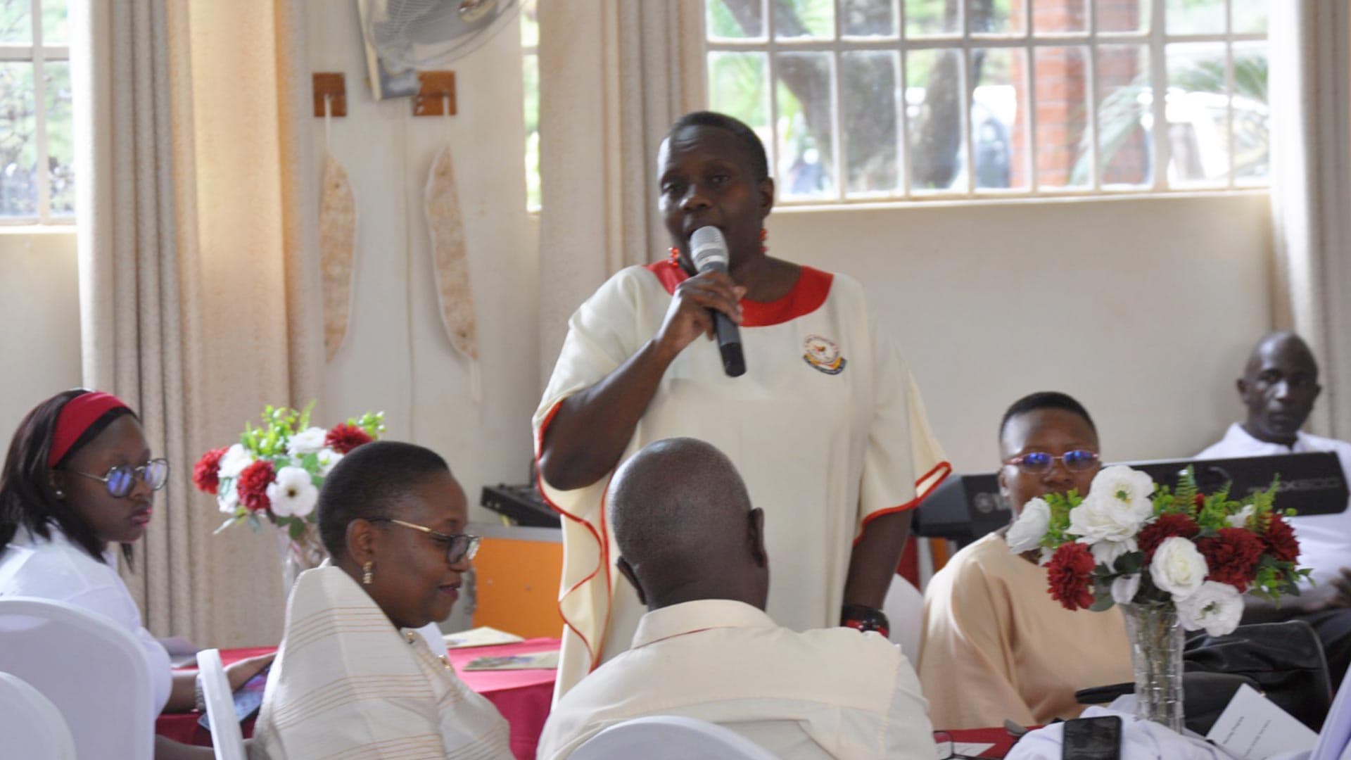 Partners and community representatives working together with Caritas Kampala