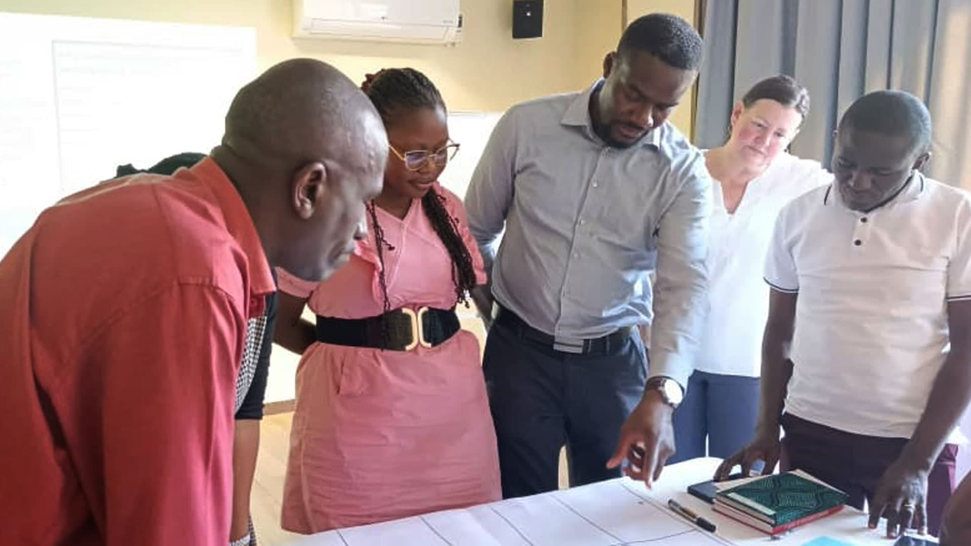 Volunteers participating in Caritas Kampala community outreach and programme activities